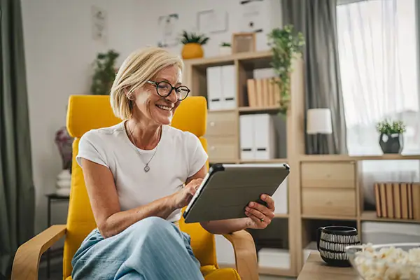 Older lady smiling viewing options.